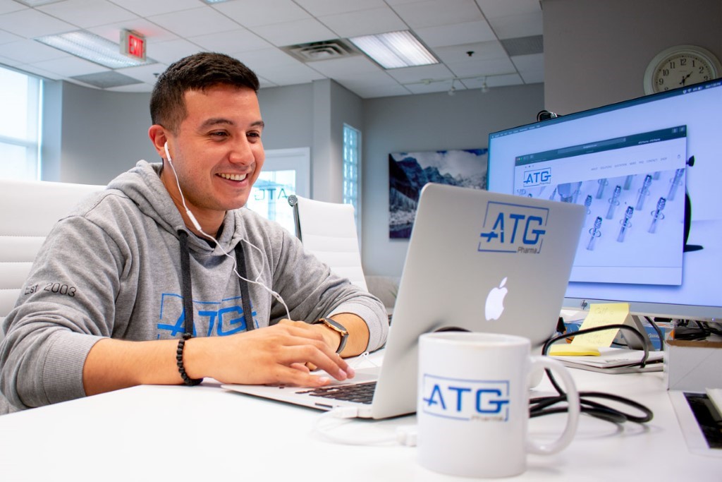 ATG employee smiling on a technical support zoom call.