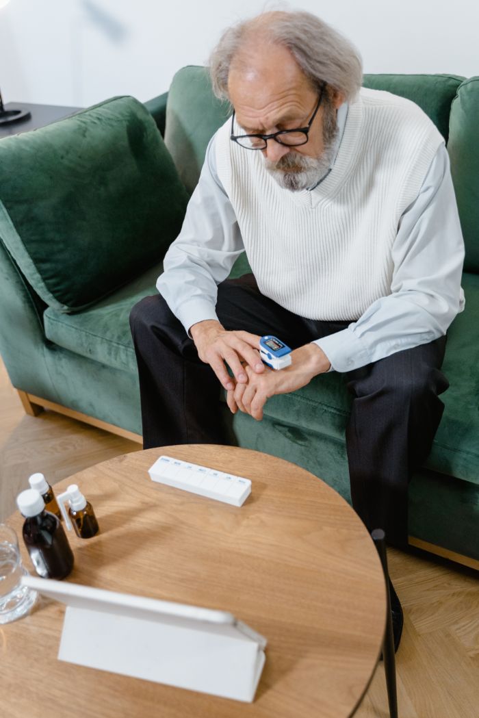 An older man considering his medications