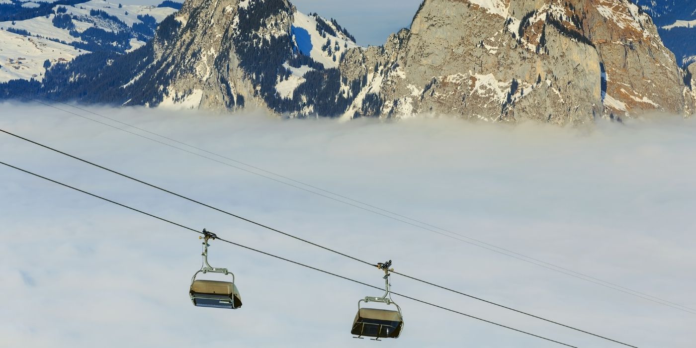 Two ski lifts with a mountain behind them near Vail, Colorado