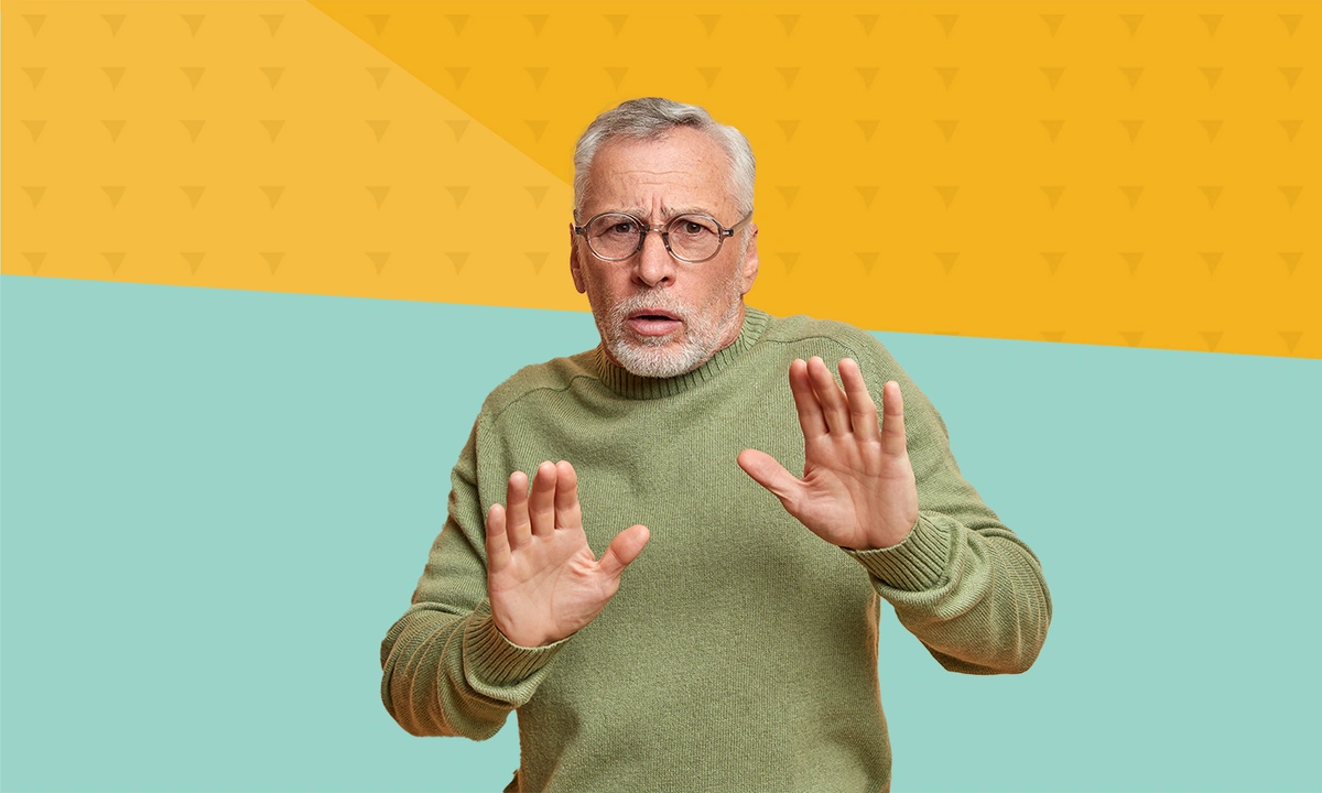 Man holding his hands up apprehensively
