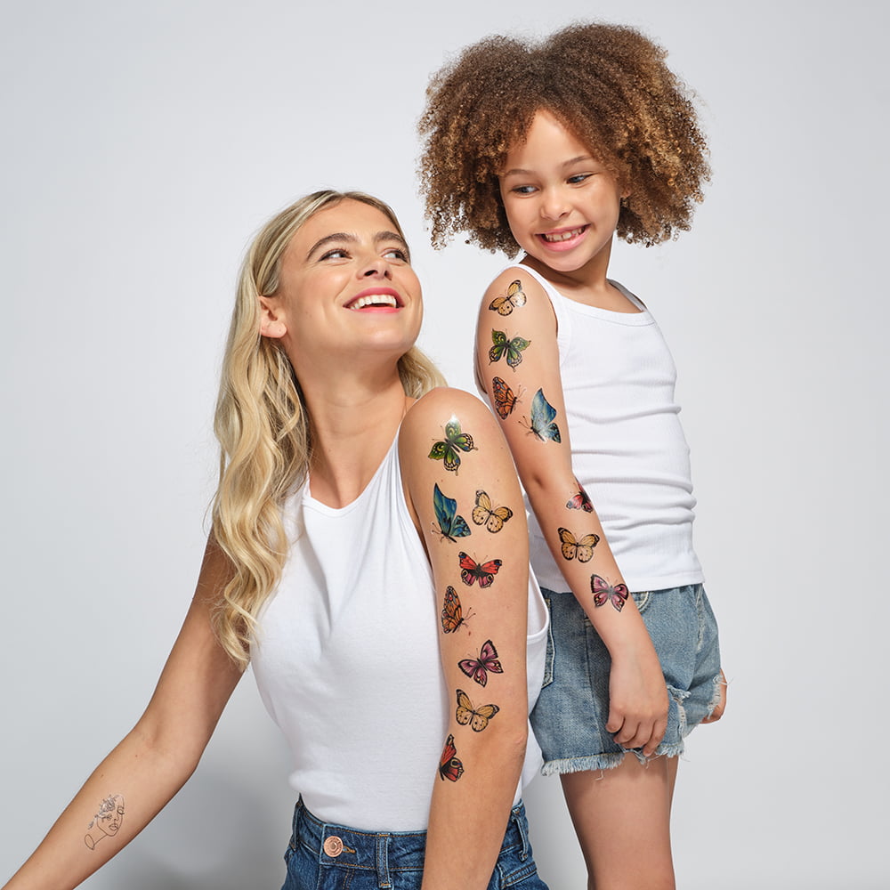 woman and girl with temporary tattoos