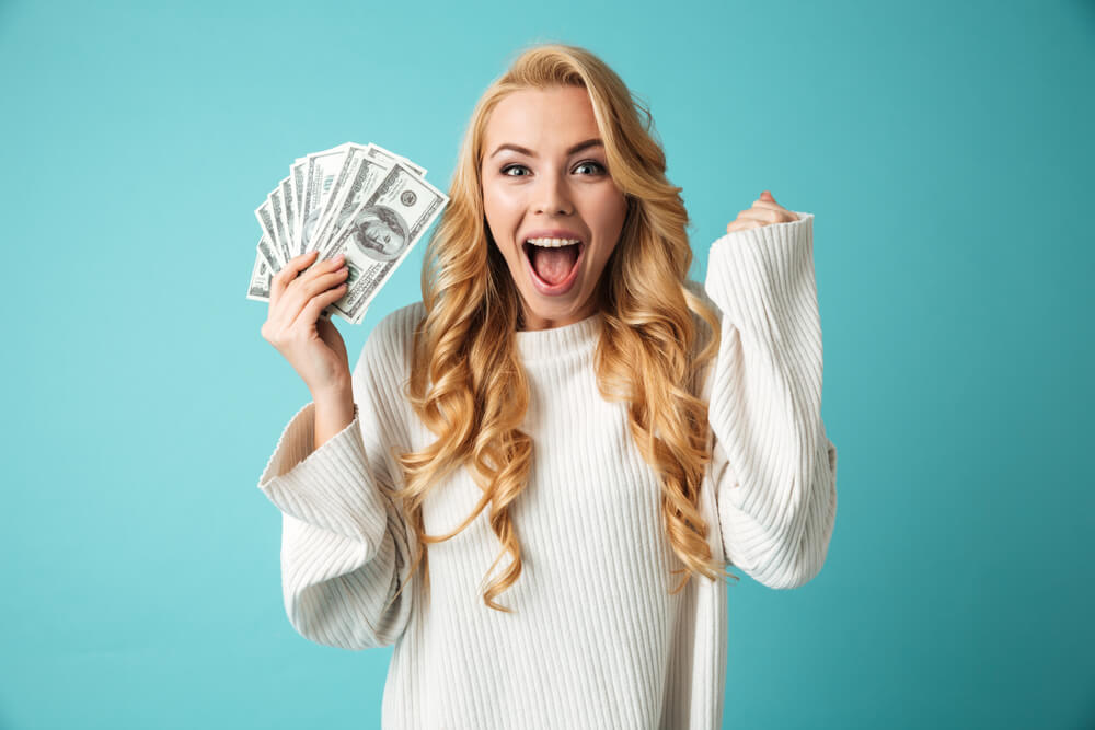 Woman happy about cash