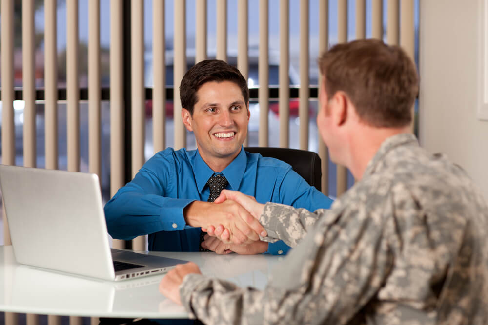 man applying for a military veteran loan in a bank