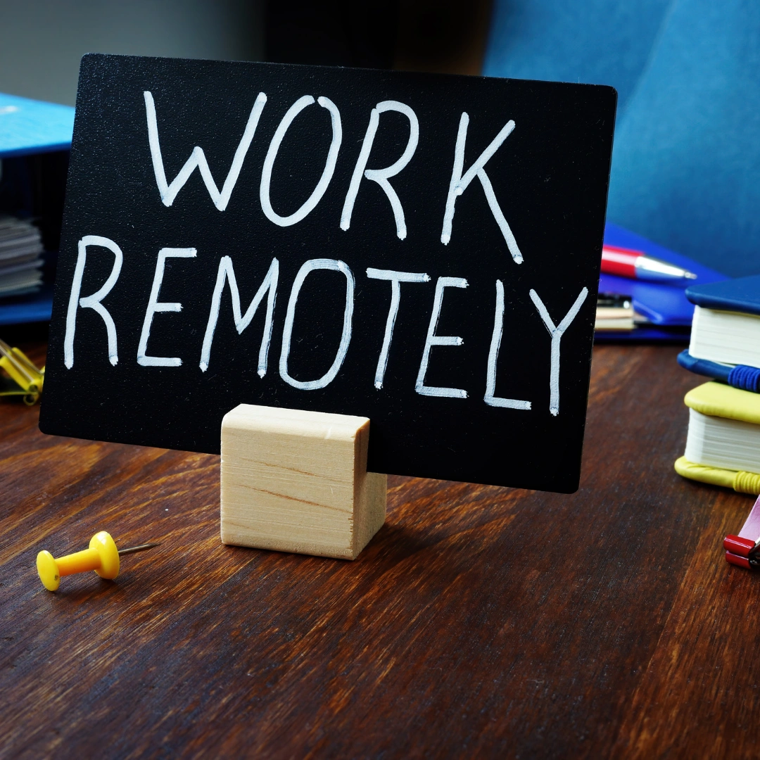 A work remotely sign in an office.