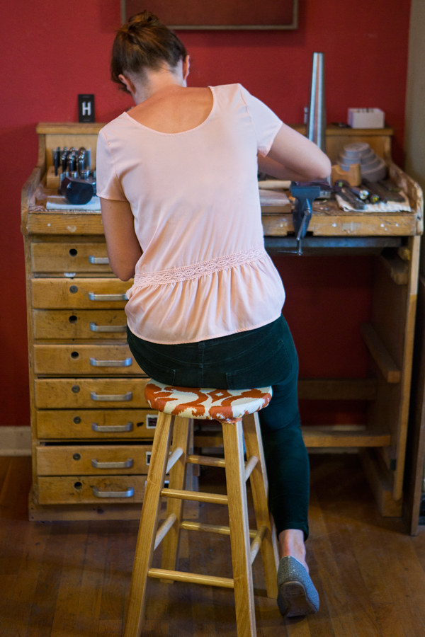 Woman working at jewelry bench