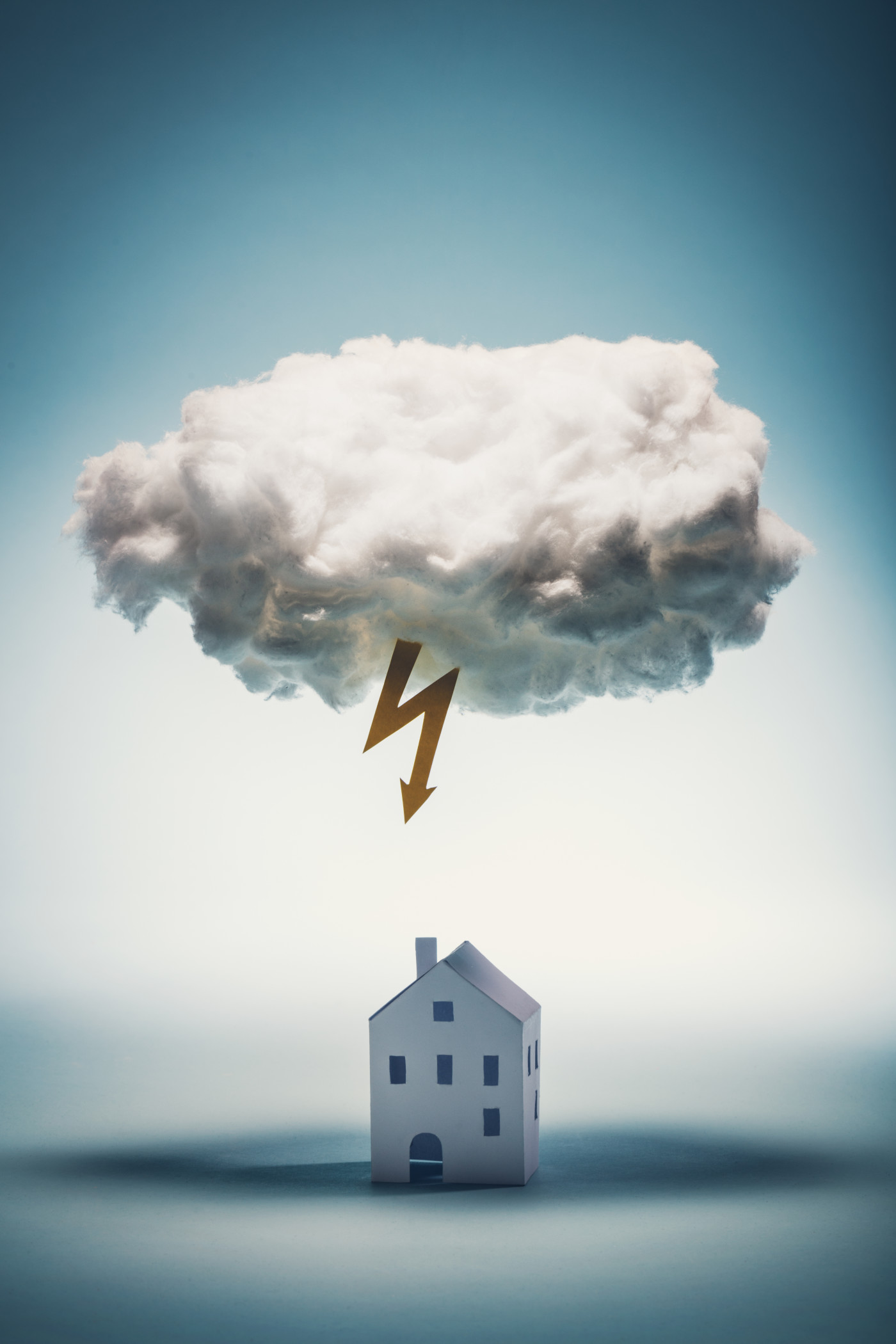 Cloud with arrow lightening and paper house