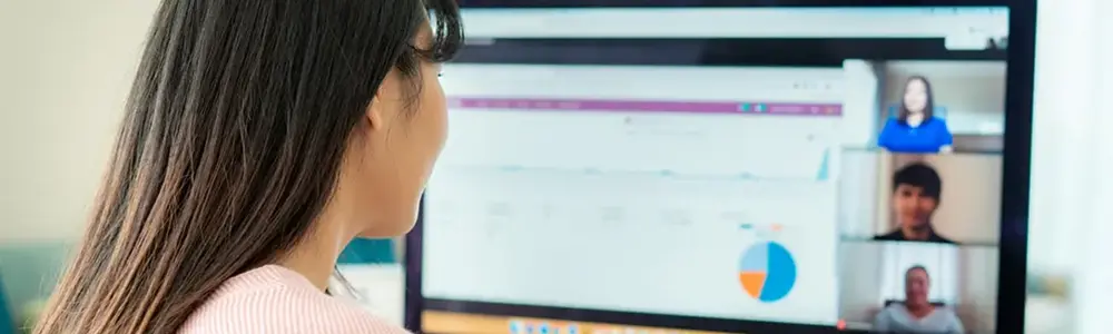 woman participating in online meeting on pc