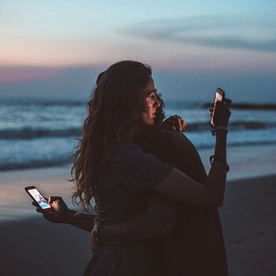 Couple distracted by their phones.