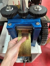 copper and a brass texture plate going through the rolling mill