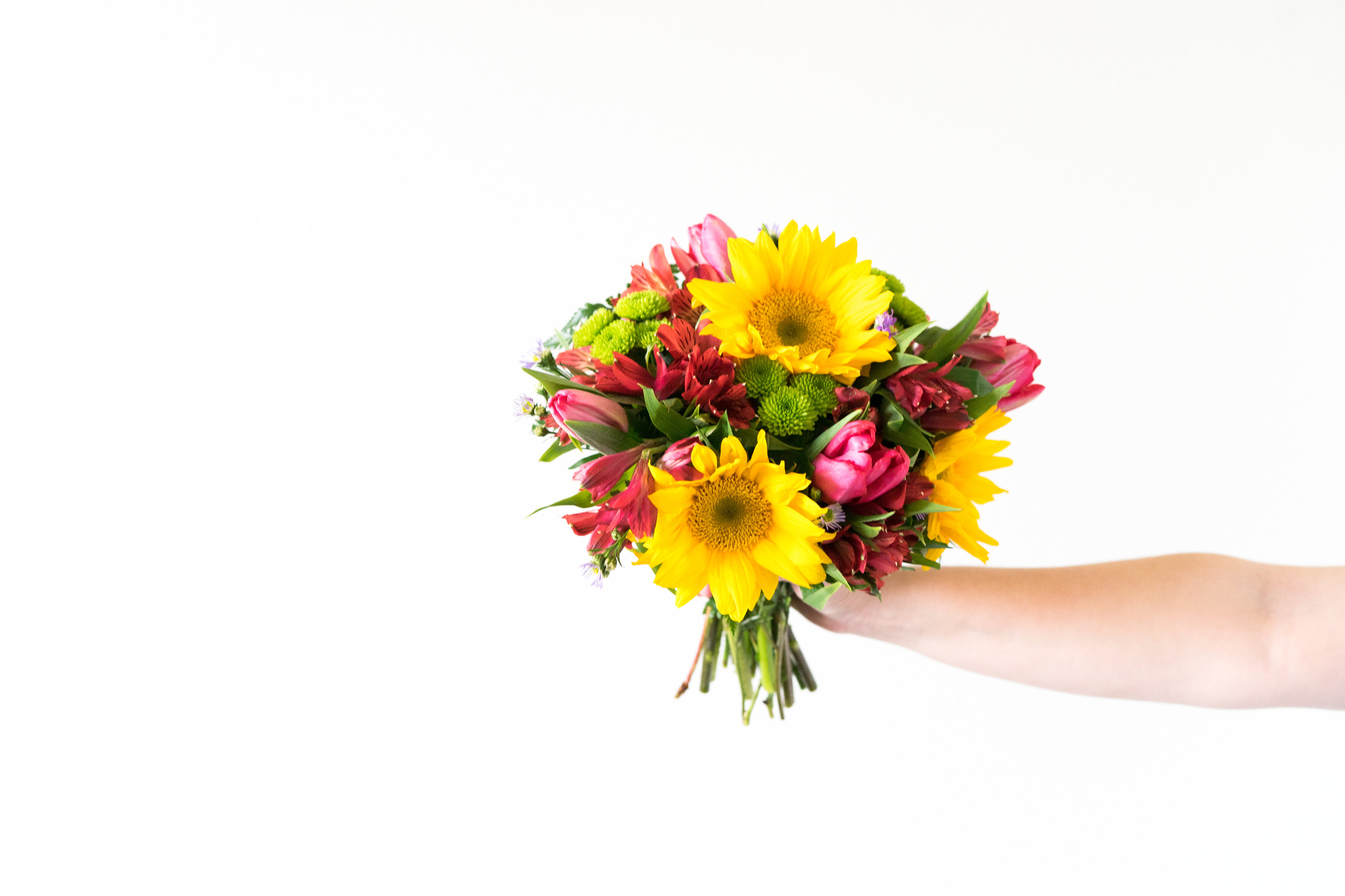 Sunflower Bouquet in Someone's Extended Hand