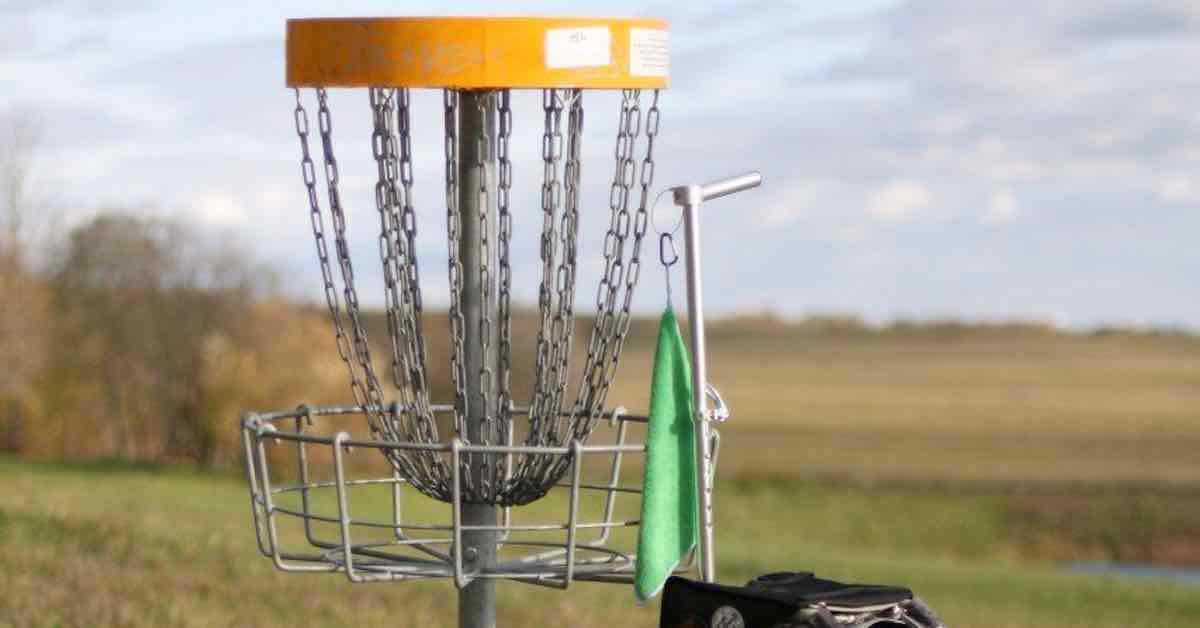 Disc golf basket in open area