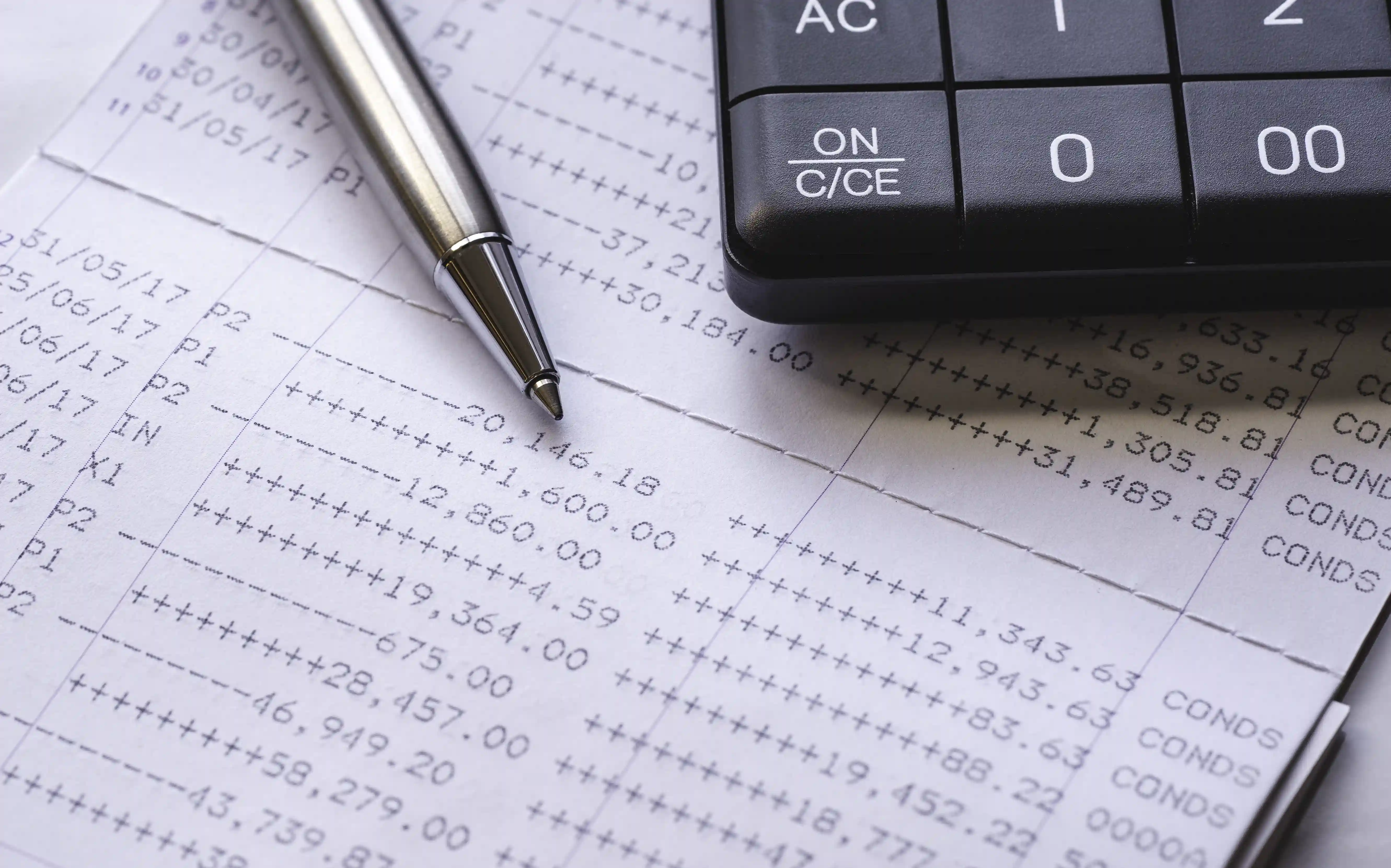 Financial data with calculator symbolizing cost optimization and operational planning
