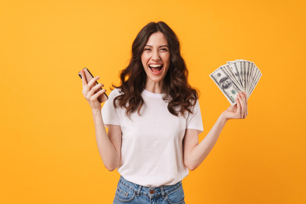 happy lady with cash