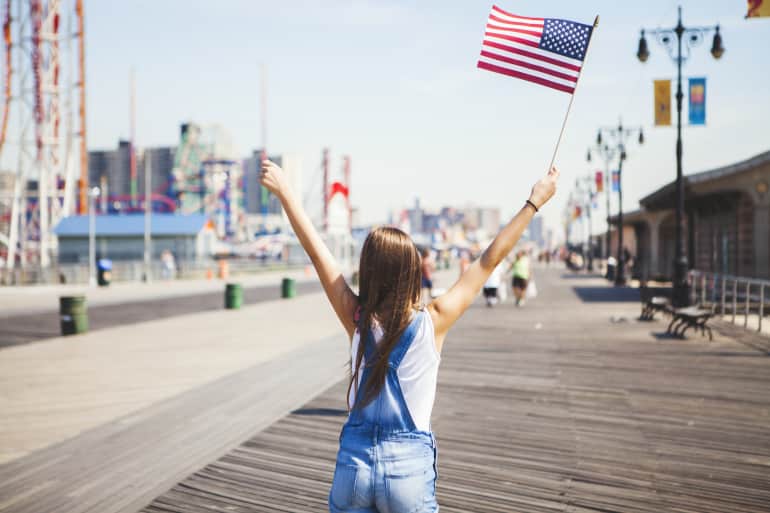 girl waving American flag