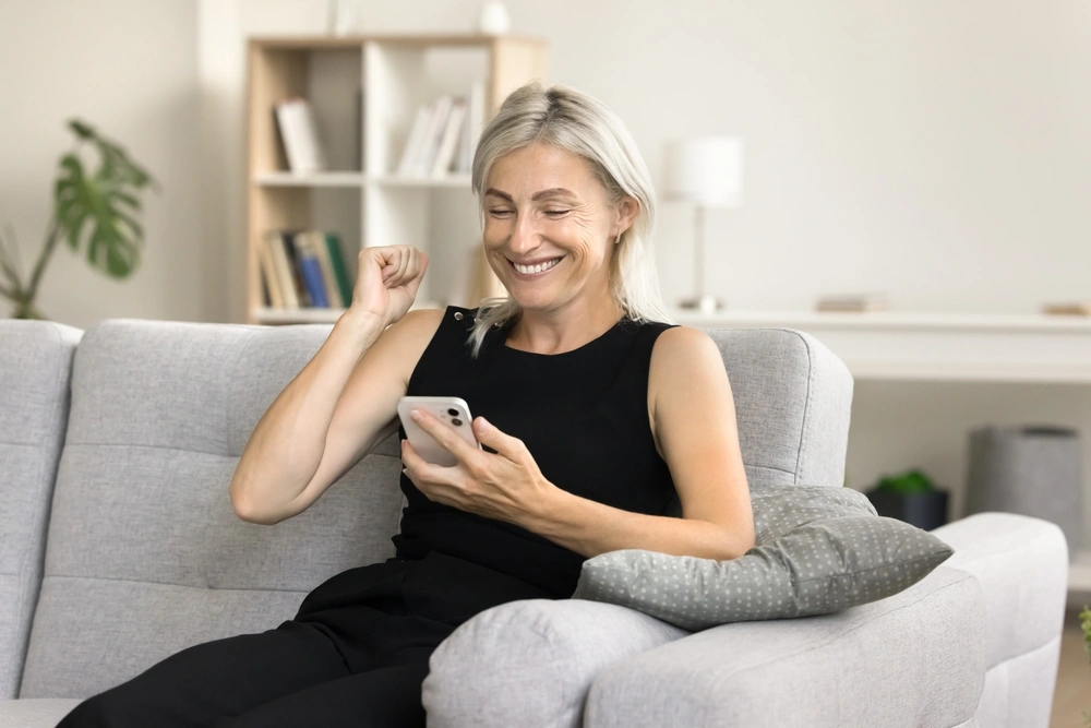 Woman looking at loan offers on her smartphone
