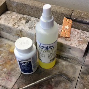 Spray flux and paste flux at the soldering station