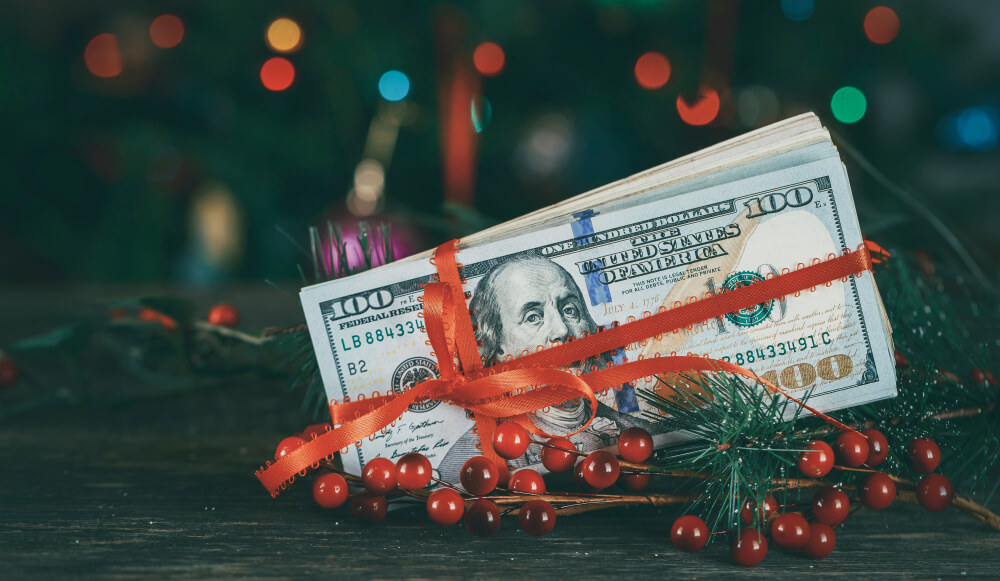 holiday cash wrapped in a bow