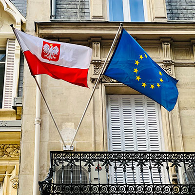 The flags of the Consulate General of Poland and the European Union.