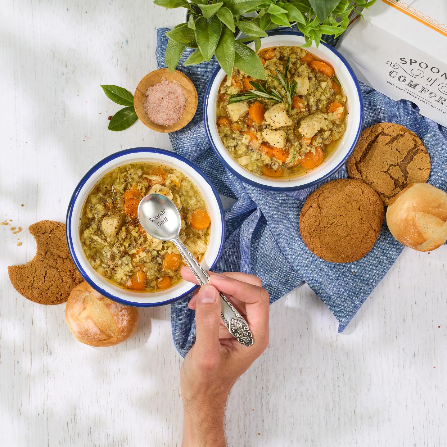 Two bowls of chicken noodle soup. 