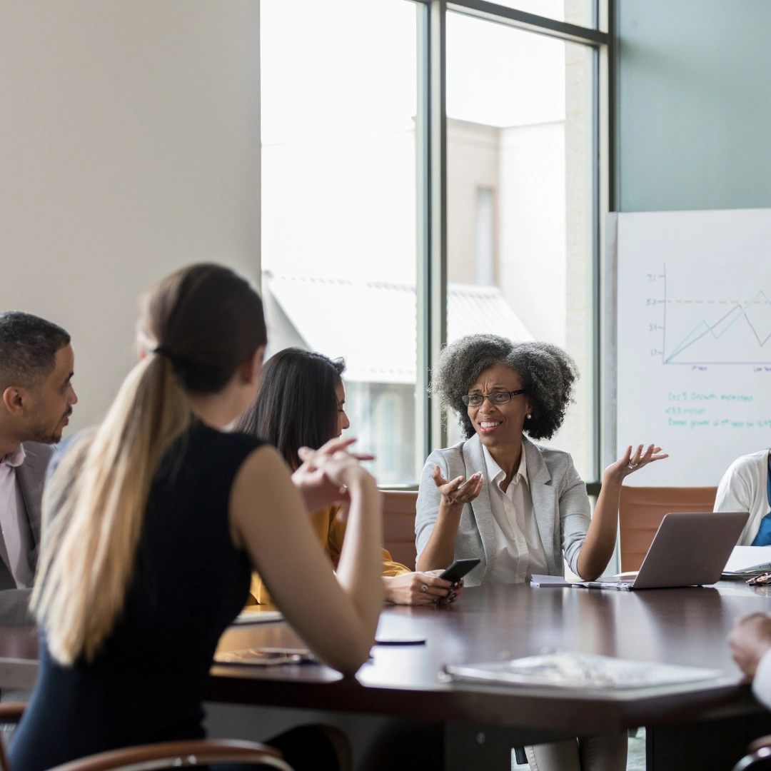 A group of team members discussing their non-profit.