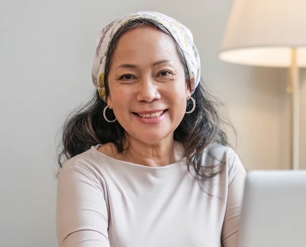 Finance representative smiling at desk