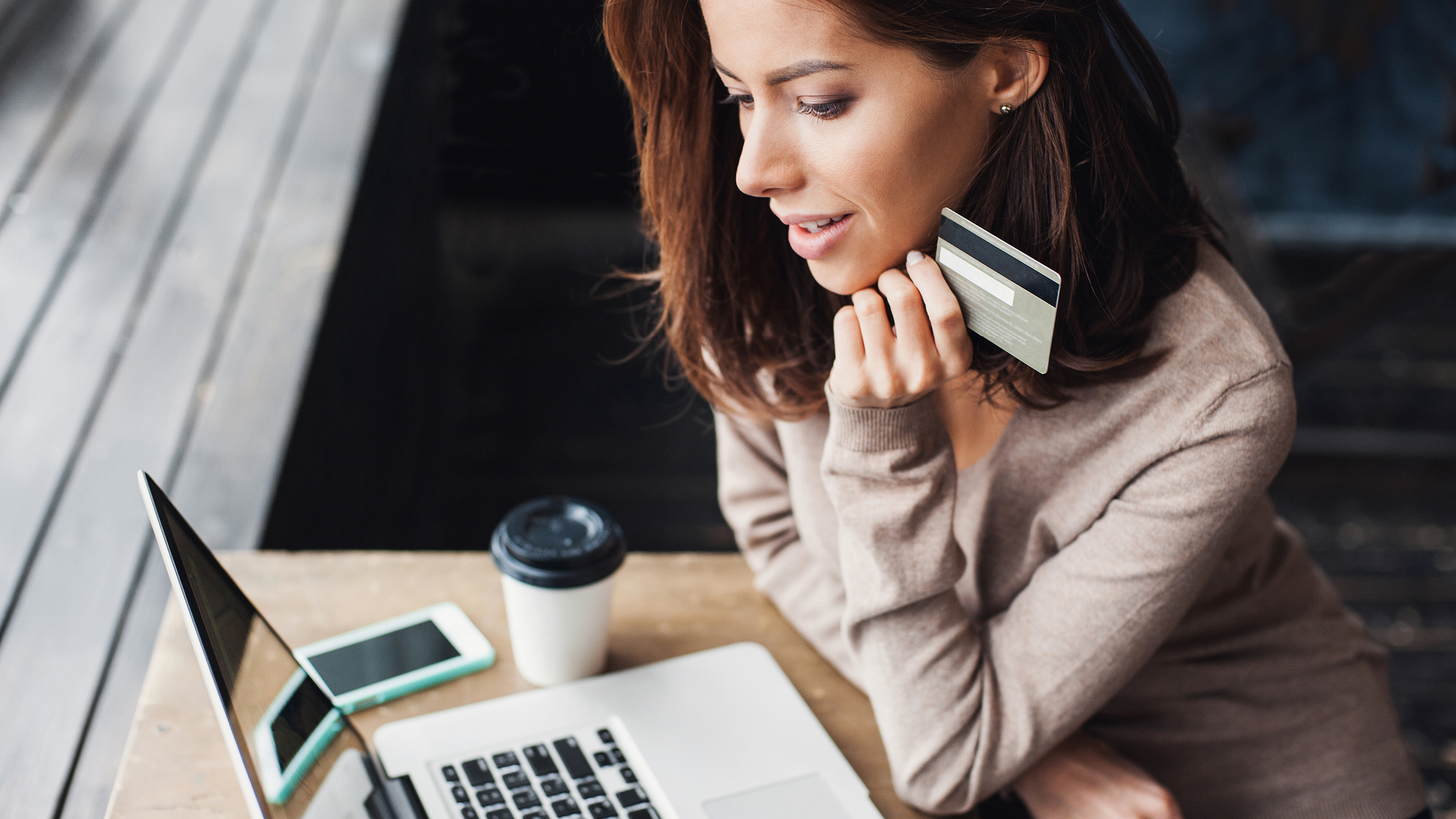 Woman shopping online with her credit card