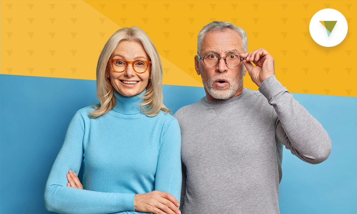 Elederly couple looking happy at the camera
