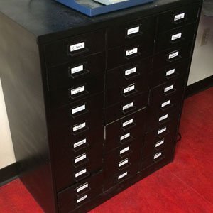 Storage cabinet for wire wrapping supplies
