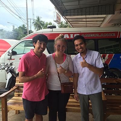 Merah in front of an ambulance