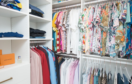 white shelving with hanger space