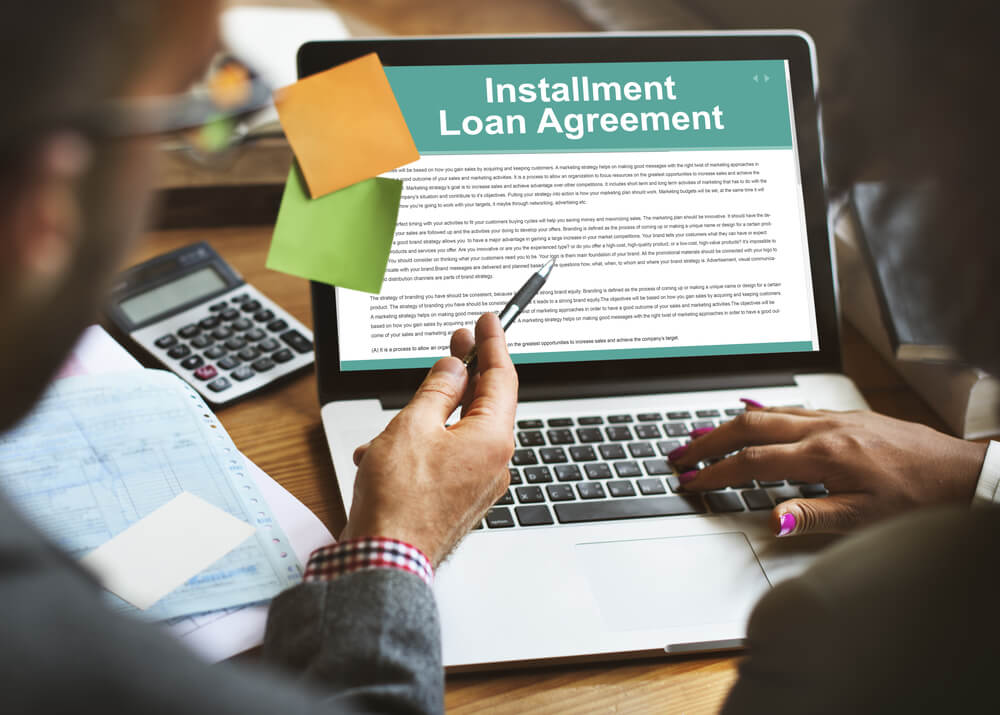 installment loan agreement on laptop