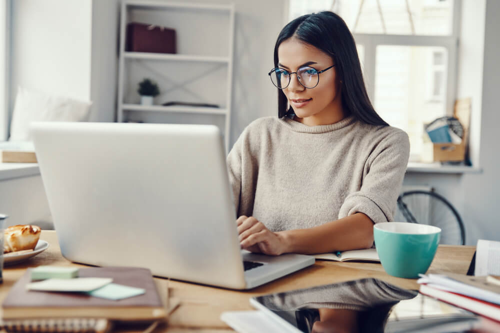 woman requesting online title loan on laptop