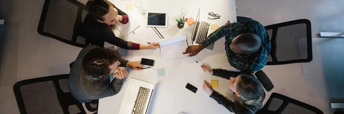 Team members around a table.