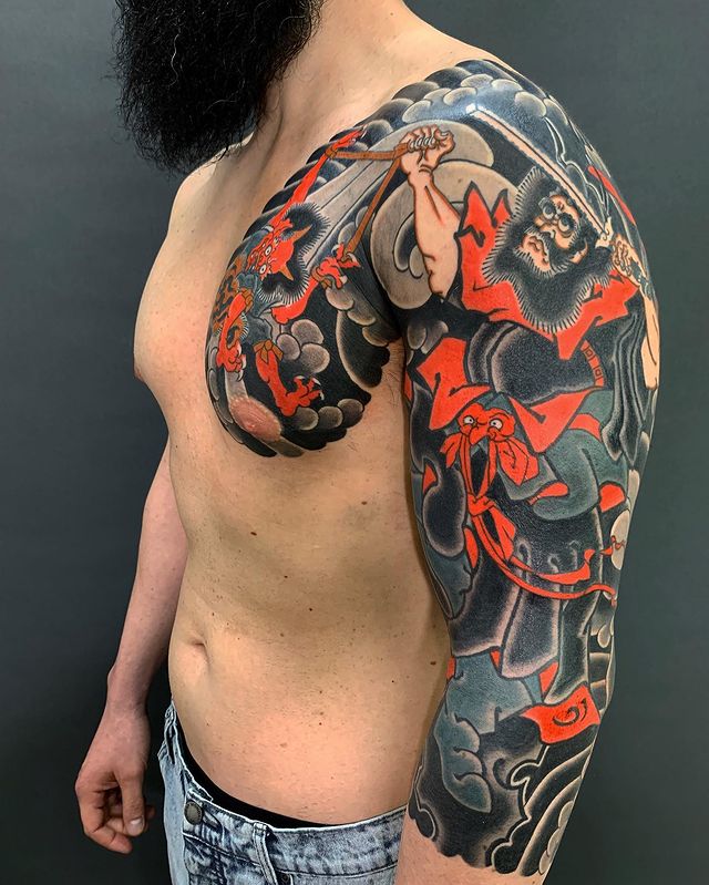 Japanese tattoo on the shoulder.