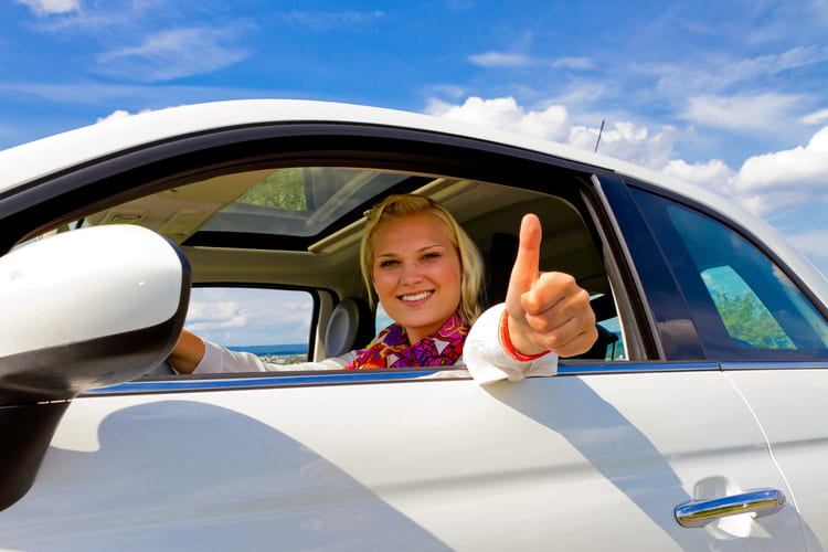 Woman driving after getting a Nevada online title loan.