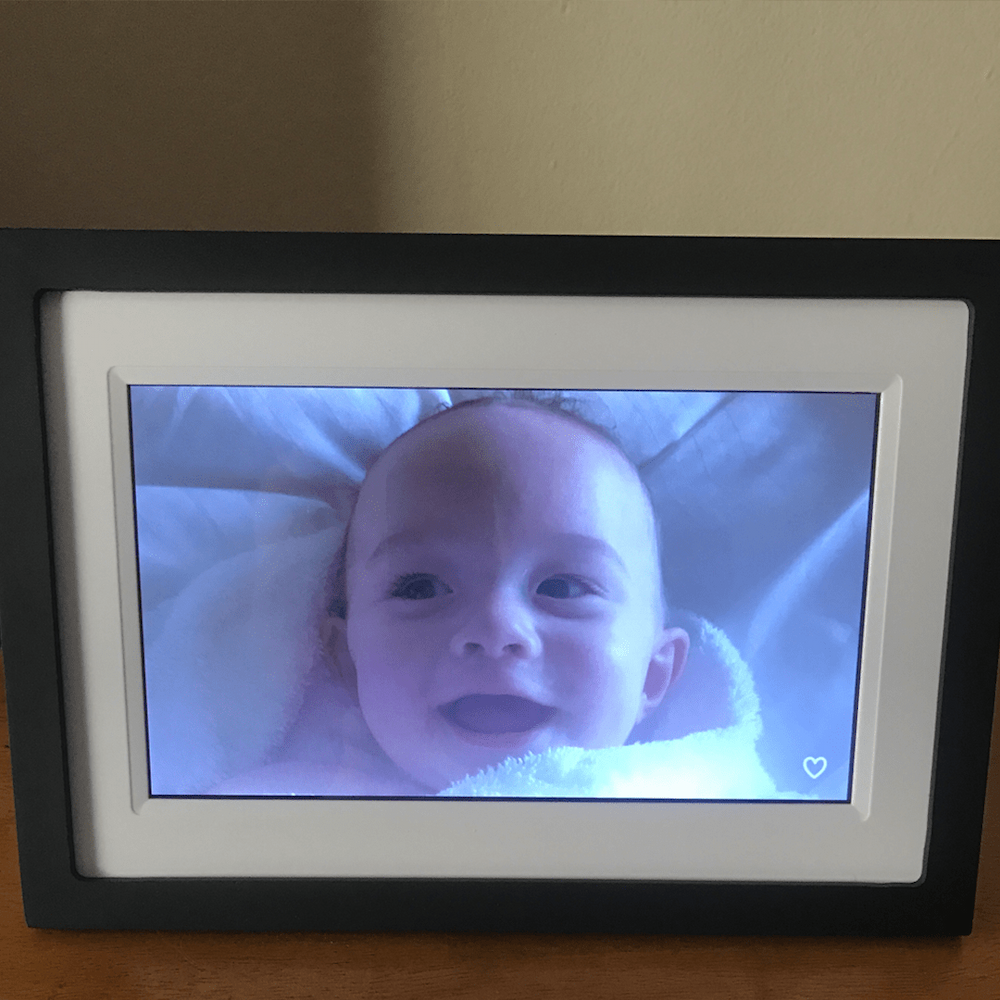 Digital photo frame with image of baby