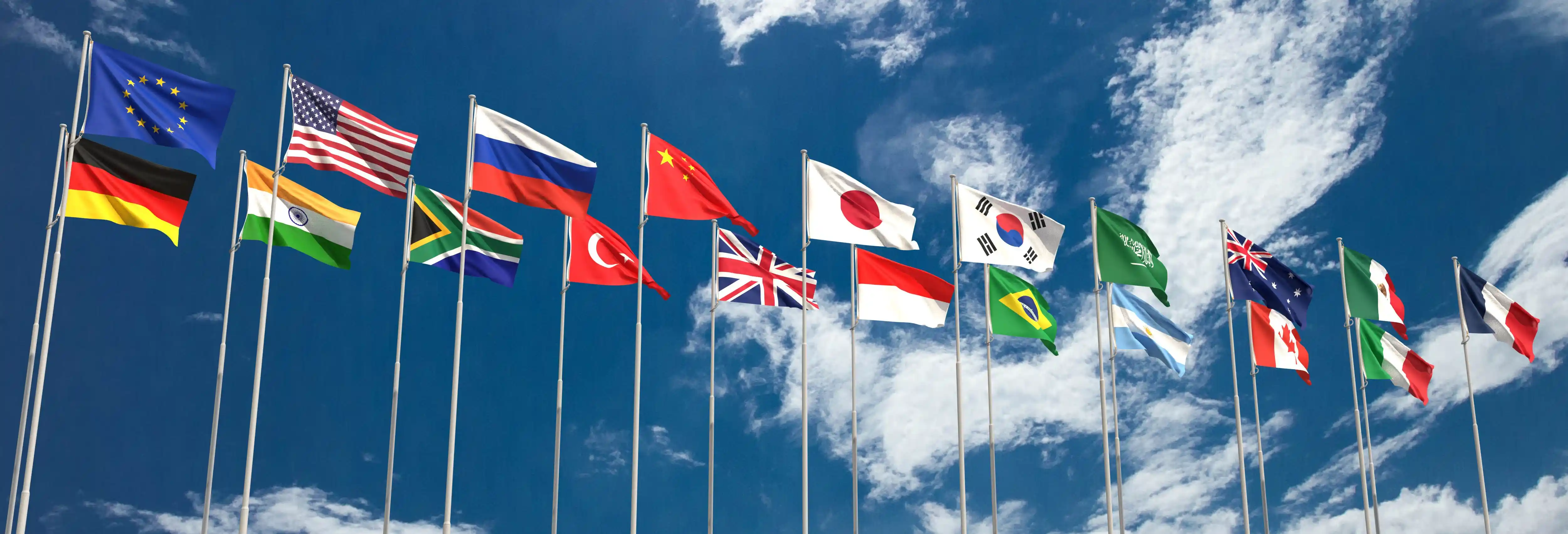 Multiple international flags representing cross-cultural global talent management and distributed team alignment