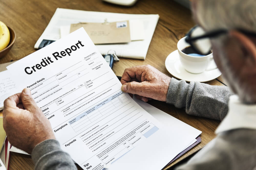 man reviewing credit report