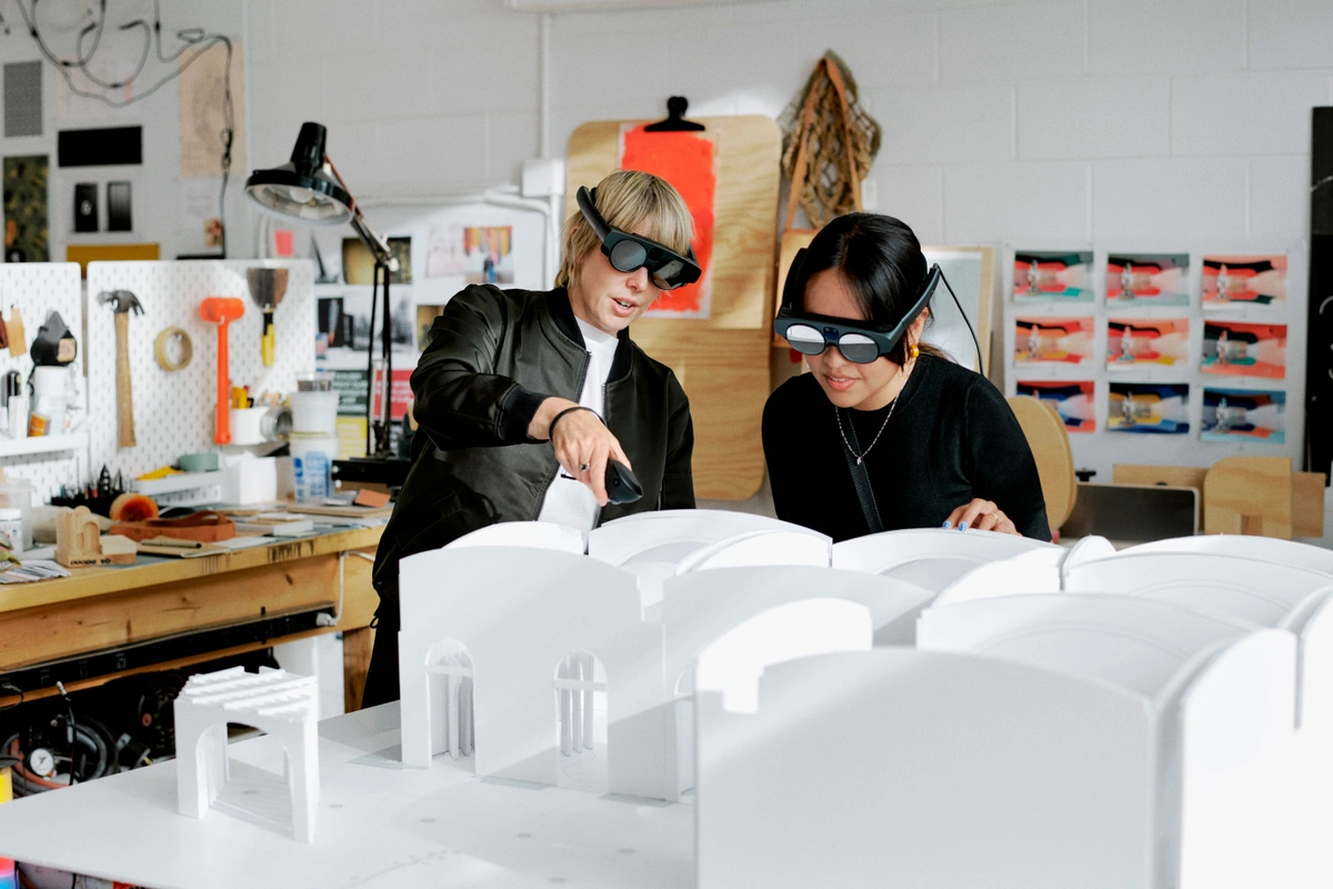 A pair of designers inspect an architectural model using the Magic Leap 2. Image via Magic Leap.