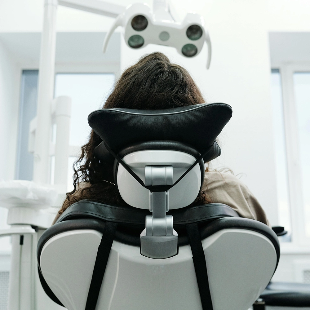A Woman Sitting on the Dental Chair.webp