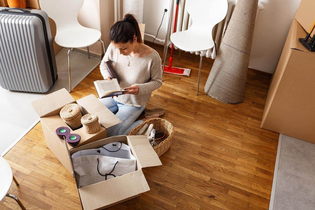 Person packing away possessions