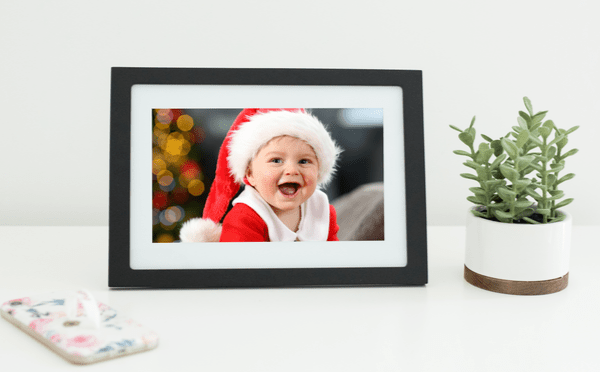 Image of a baby dressed up as Santa on digital photo frame