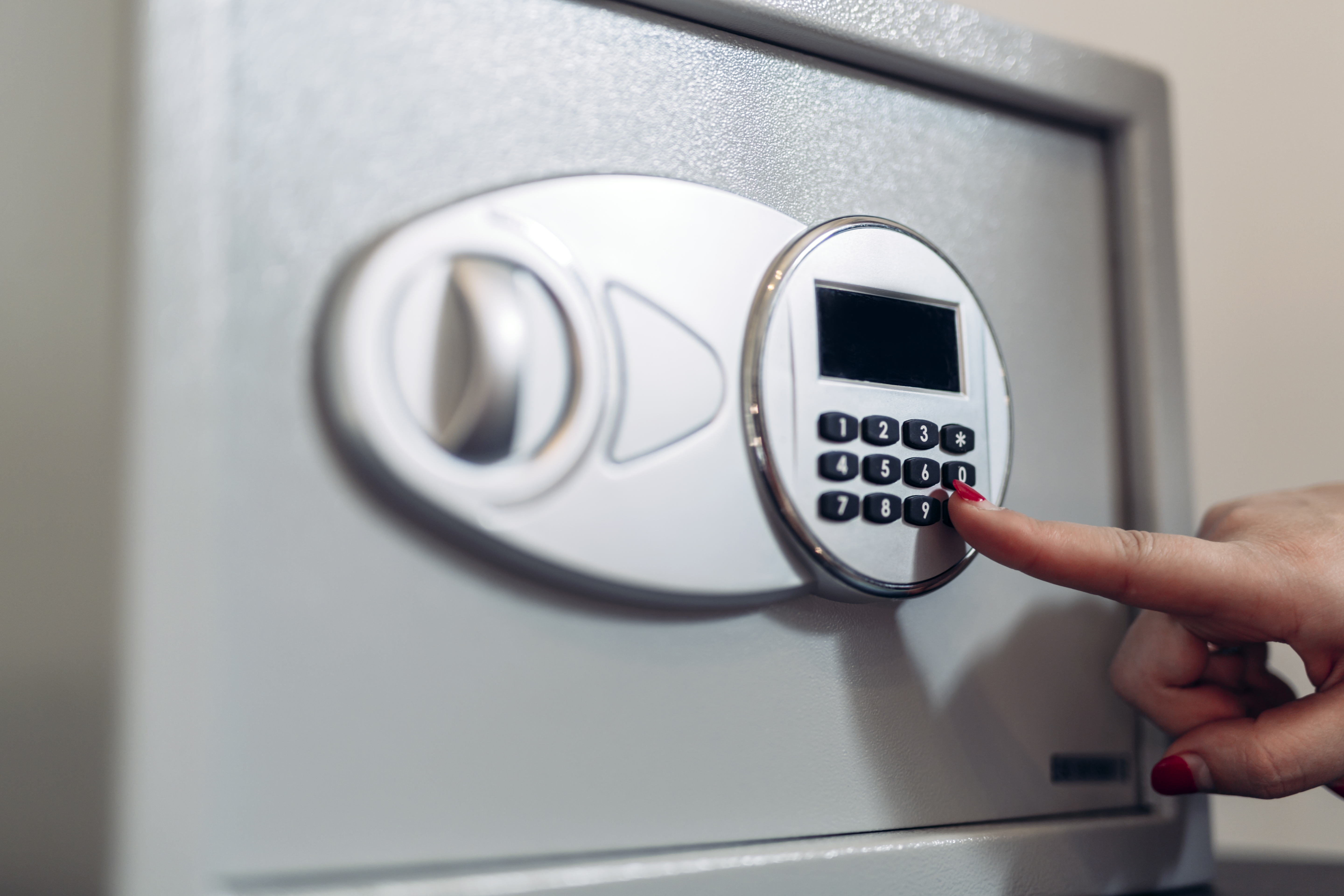 Woman opening a safe