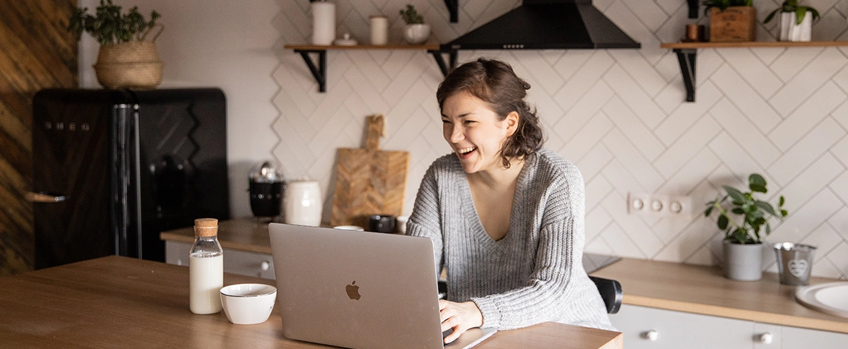 A person on a video call in their kitchen.