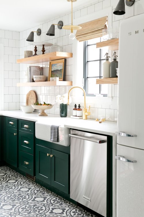 kitchen with green cabinets and gold frame