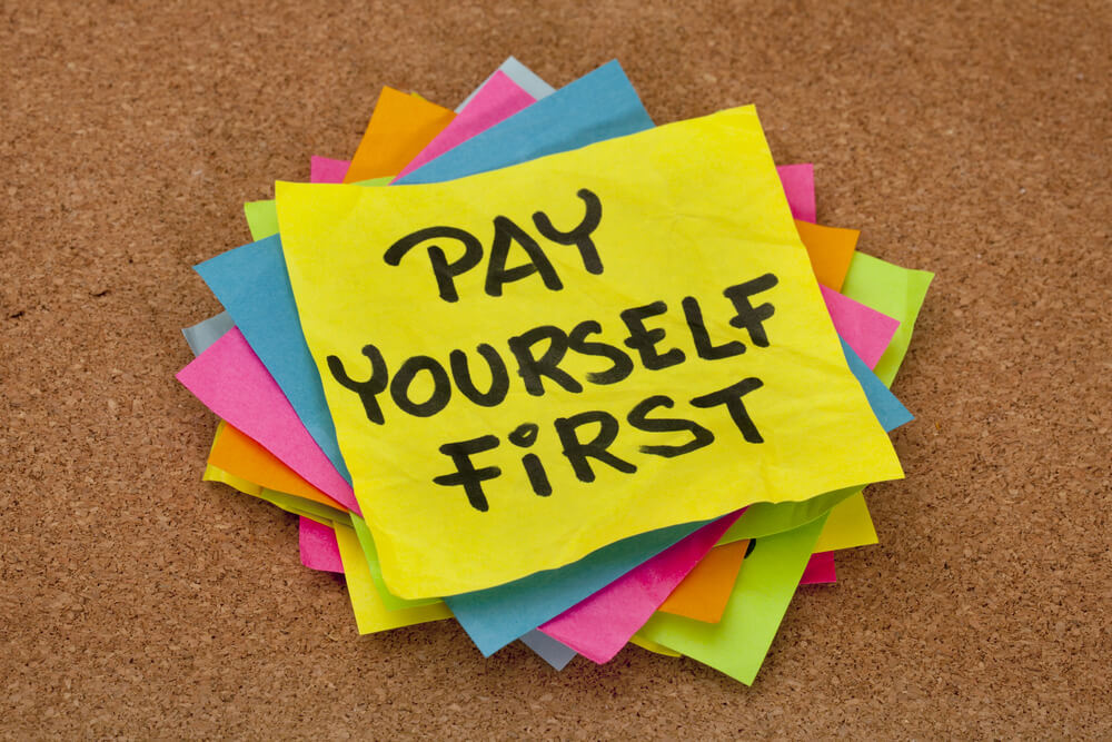 pay yourself written on a sticky note