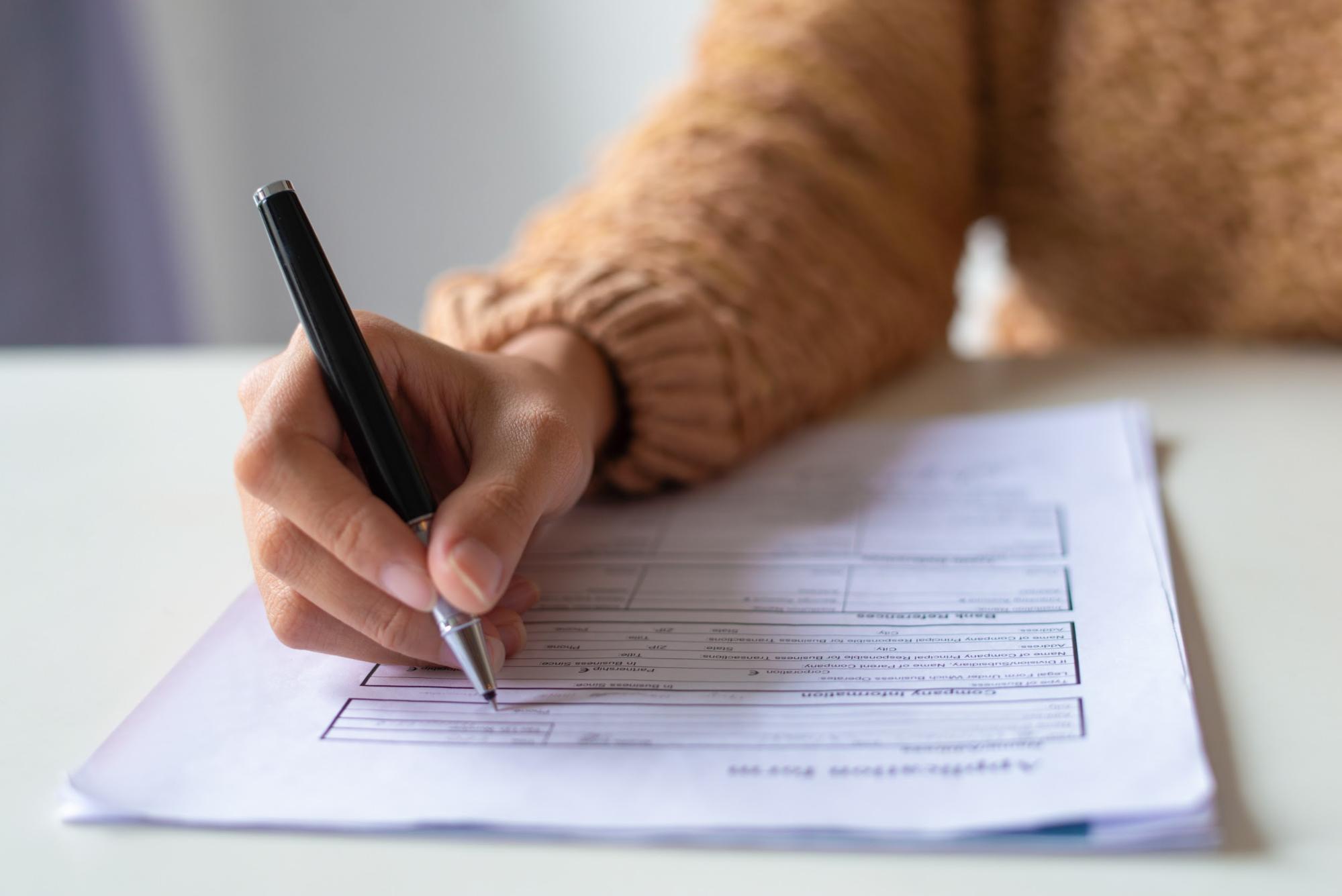 Woman filling up an application form