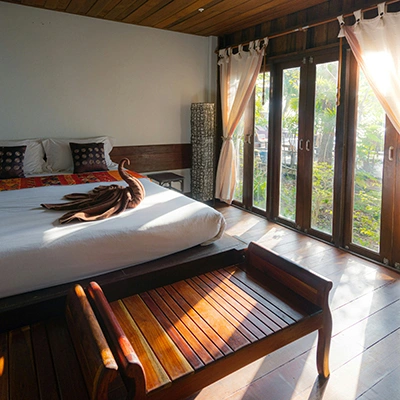 Sunshine in bright bedroom in bungalow.