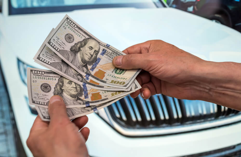 man with car title loan cash