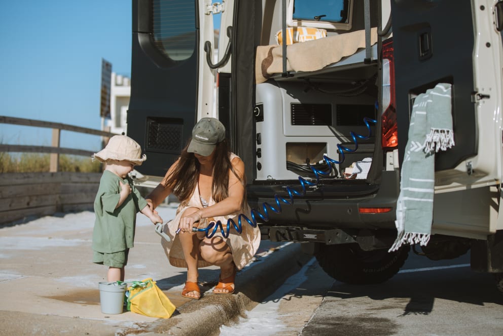 winnebago at the beach with mom and kid